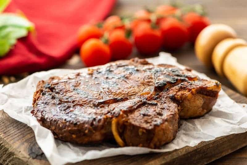 Steak laying on cutting board