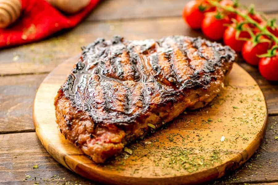 Grilled Italian dressing steak on cutting board