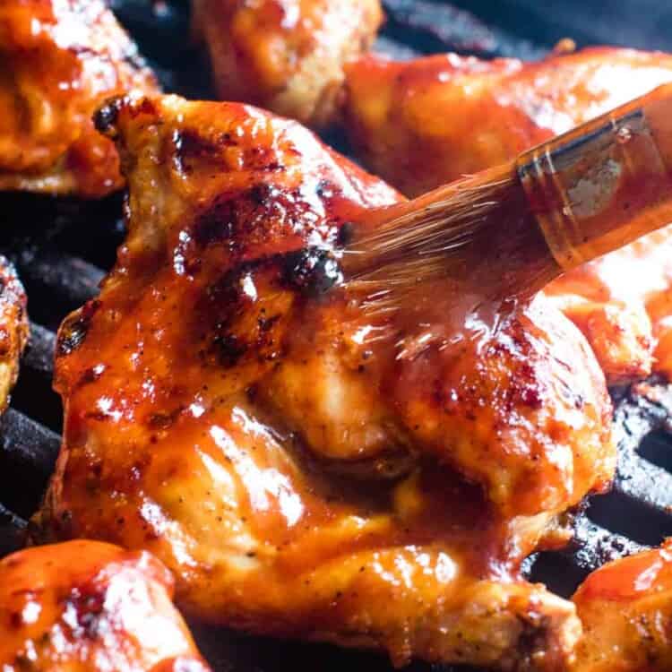 BBQ Chicken Recipe being brushed with barbecue sauce