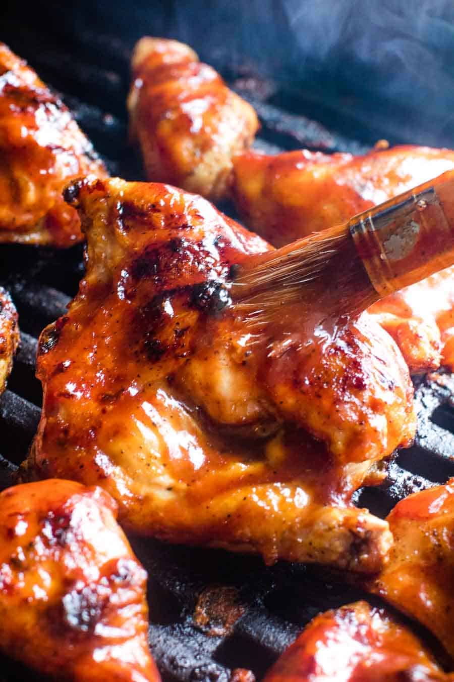 BBQ Chicken Recipe being brushed with barbecue sauce