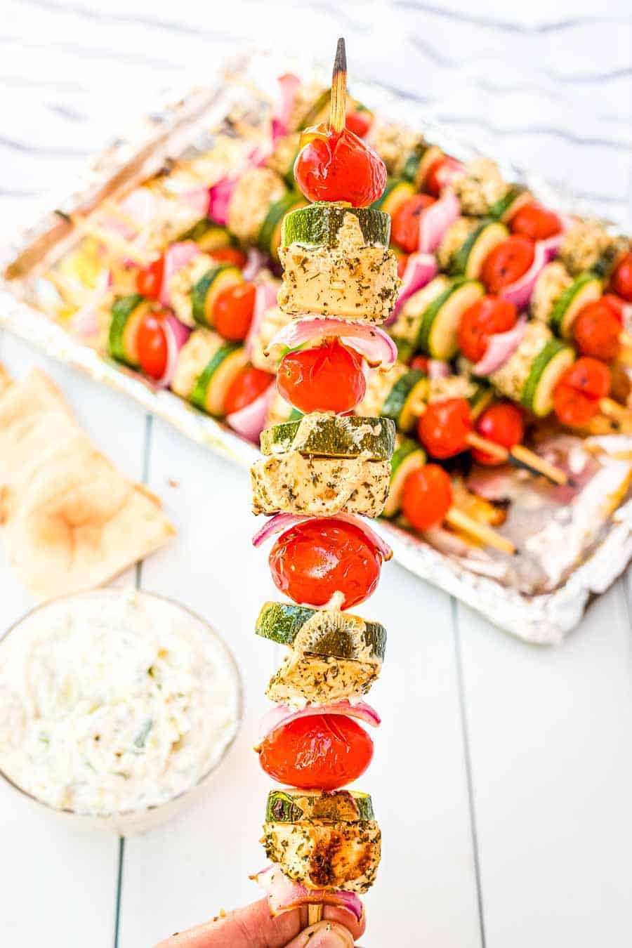 Greek Chicken Kabobs being held