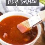 homemade bbq sauce in a white bowl with a brush