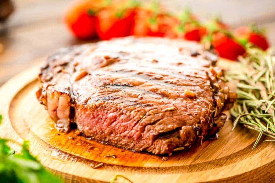 Grilled balsamic Steak cut on board