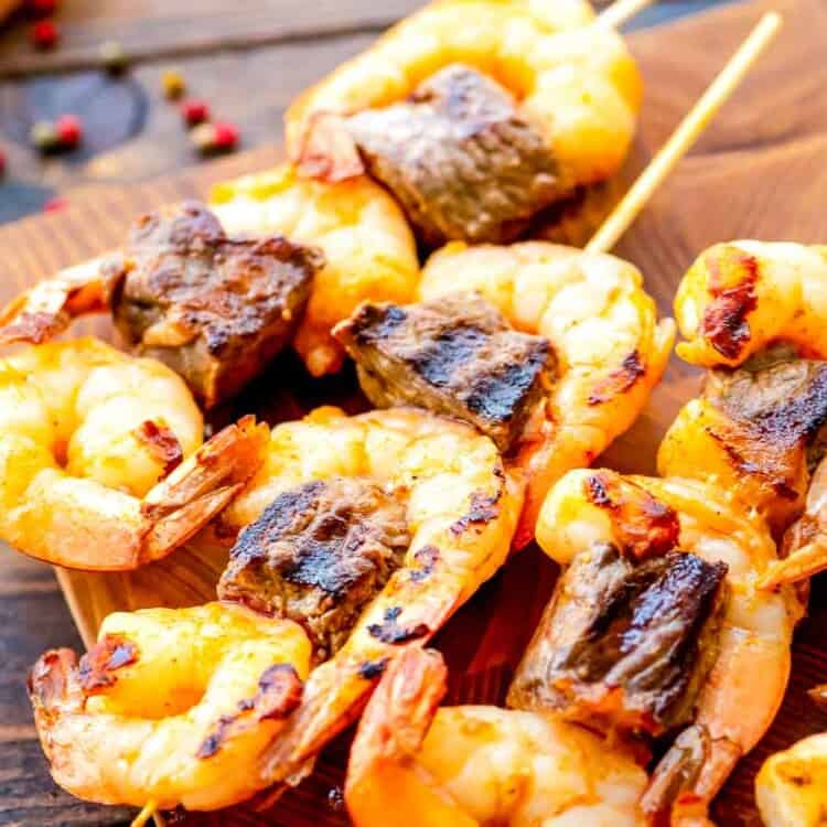 Grilled Steak and Shrimp Kabobs on cutting board
