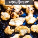 Grilled cauliflower on a black plate