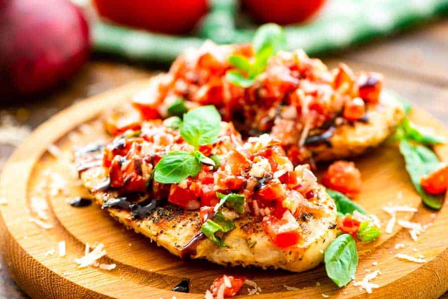 Grilled Bruschetta Chicken on cutting board