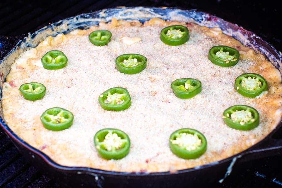 Jalapeno Popper Mac and Cheese in cast iron skillet on smoker