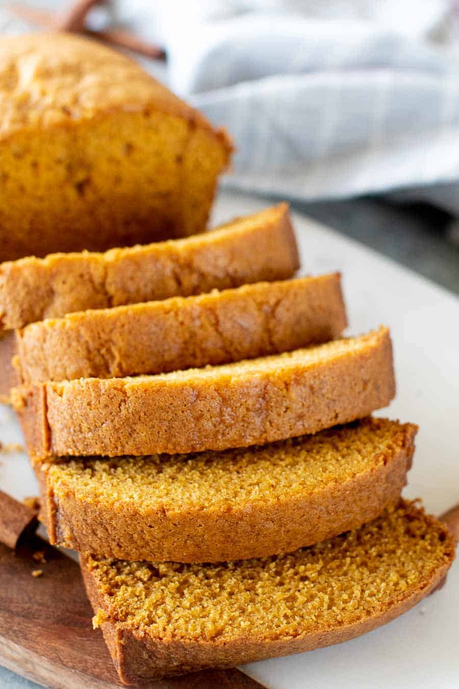 Smoked pumpkin bread slices on cutting board