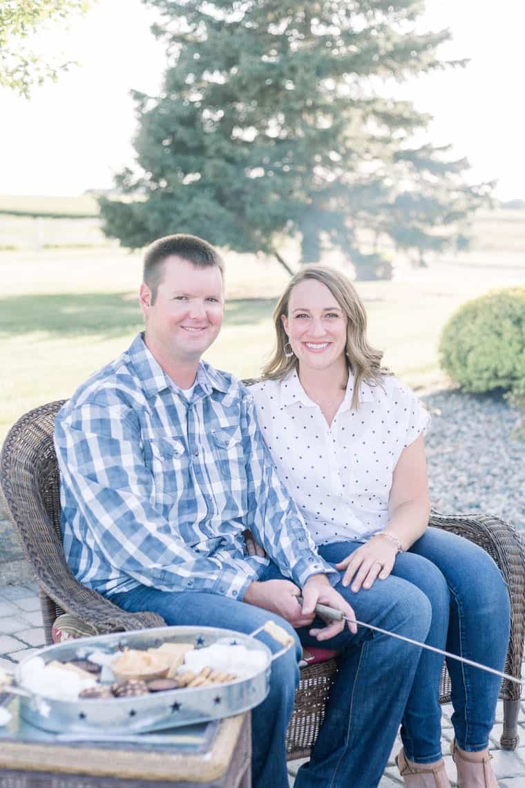 Photo of Jason and Julie sitting on a bench making smores