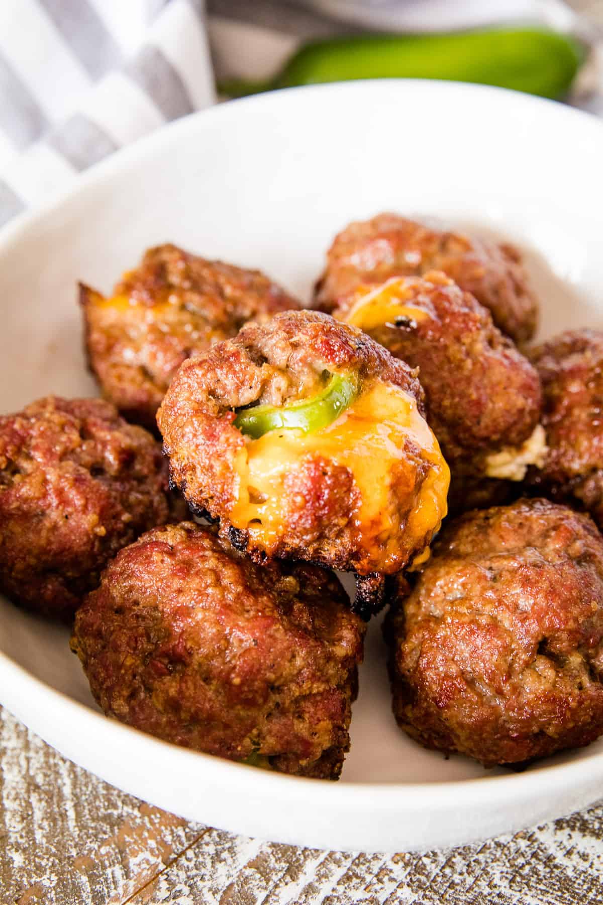 White bowl full of Jalapeno Popper Smoked Meatballs