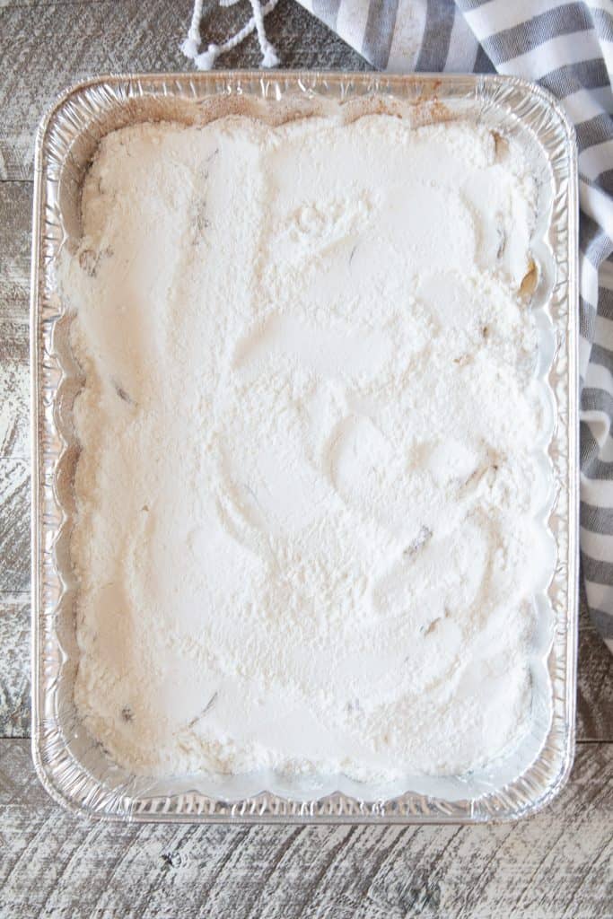 Aluminum foil pan with dry cake mix in it.