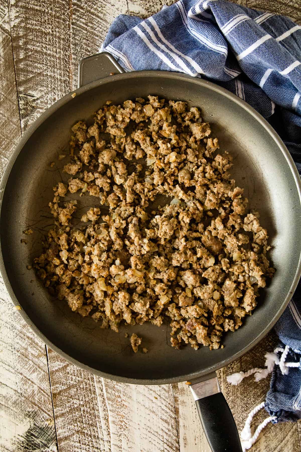 Cooked ground sausage in skillet.