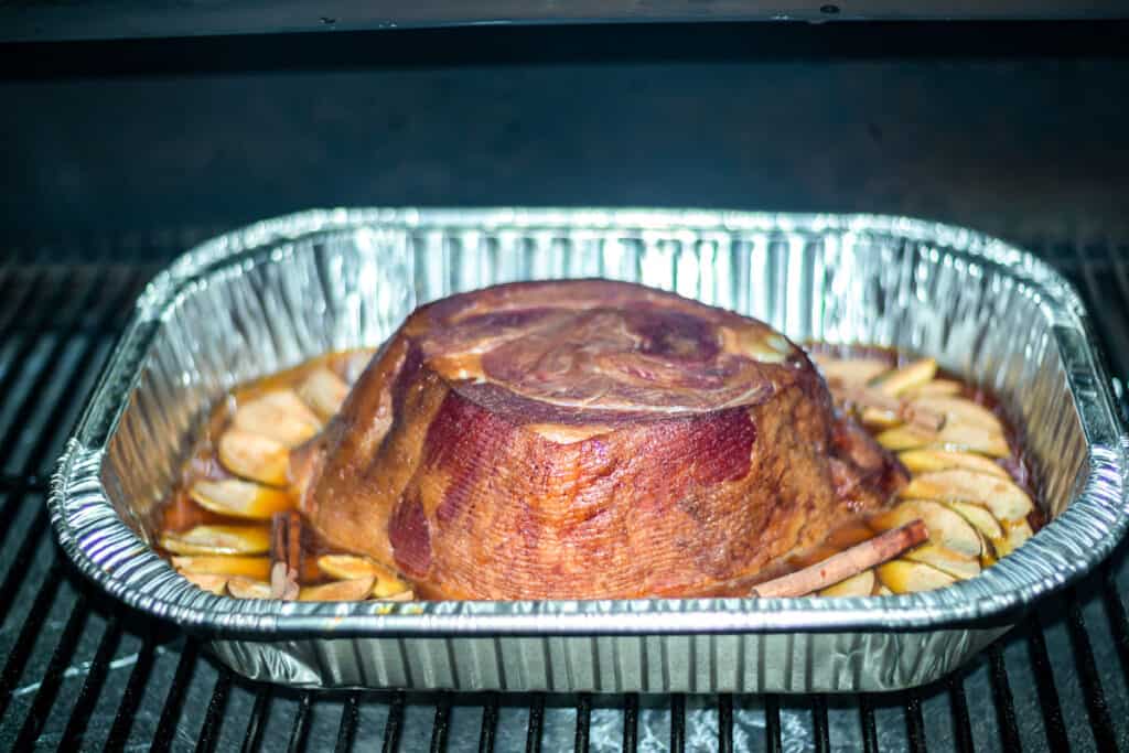 Disposable Roasting Pan with Ham in it on smoker