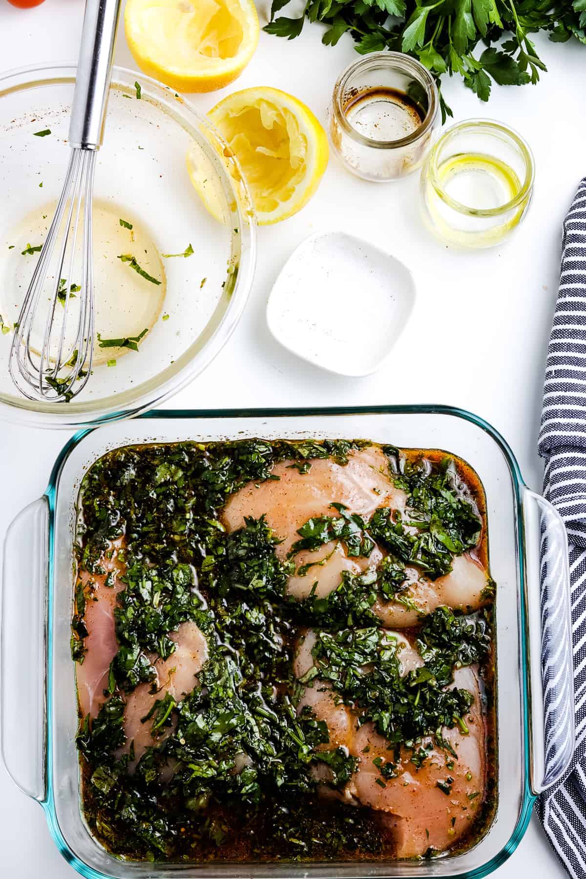 Glass dish with chicken breasts and marinade
