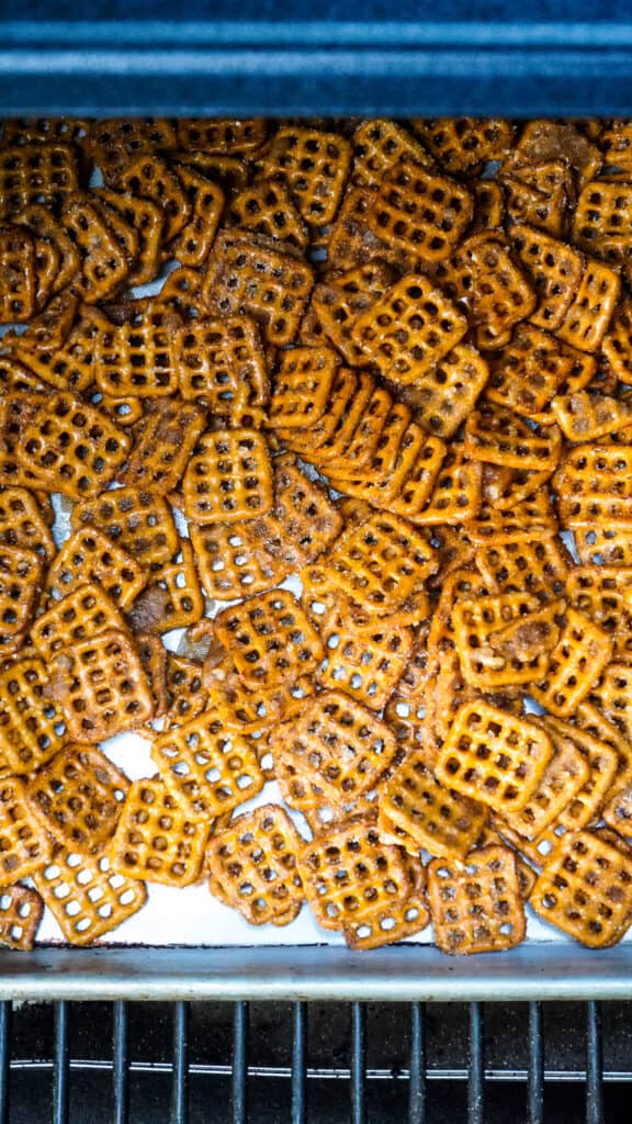 Overhead image of cinnamon sugar pretzels on sheet pan in smoker