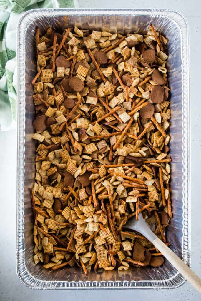 Mixing snack mix in a disposable aluminum foil pan