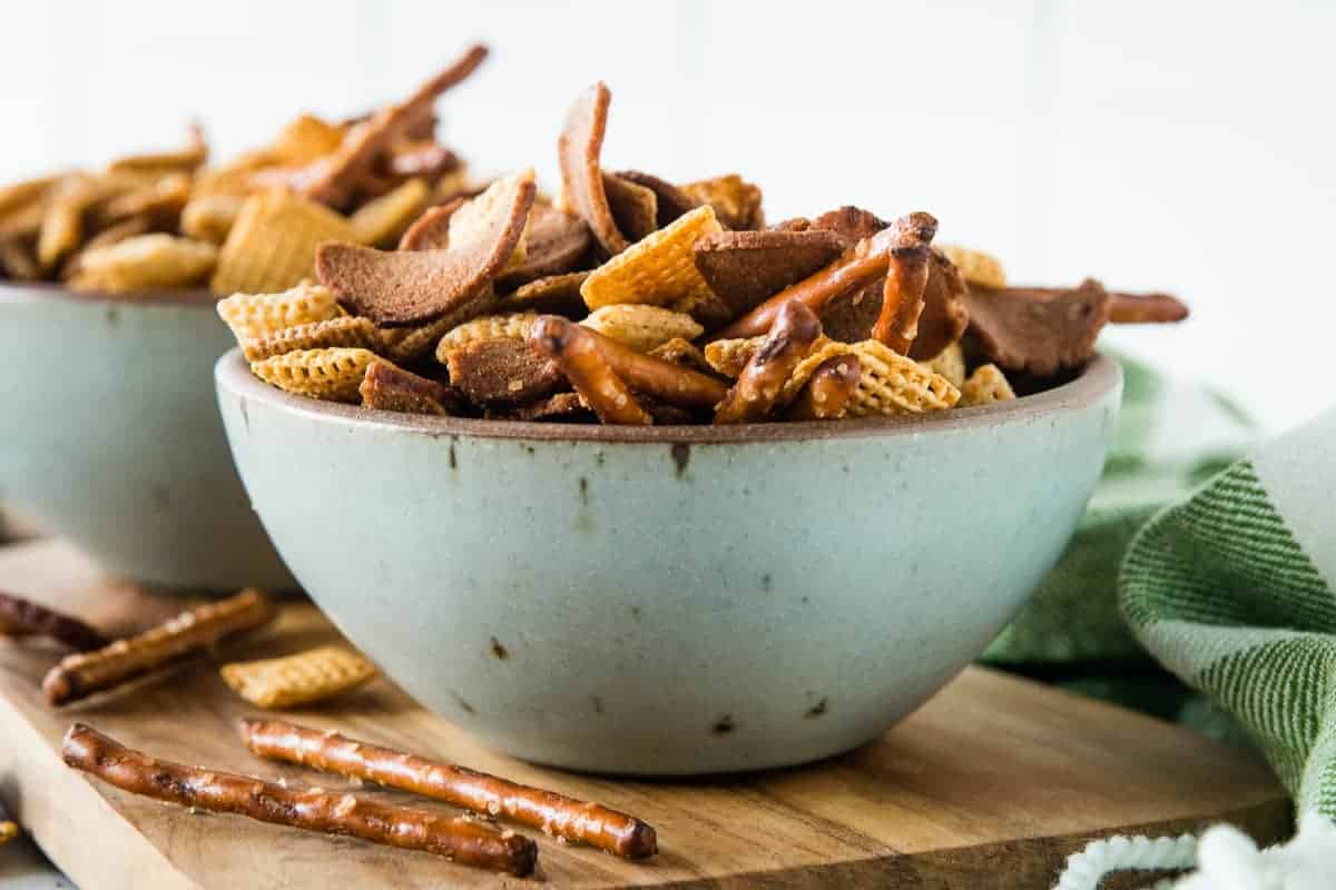 Gray bowl with smoked chex mix in them