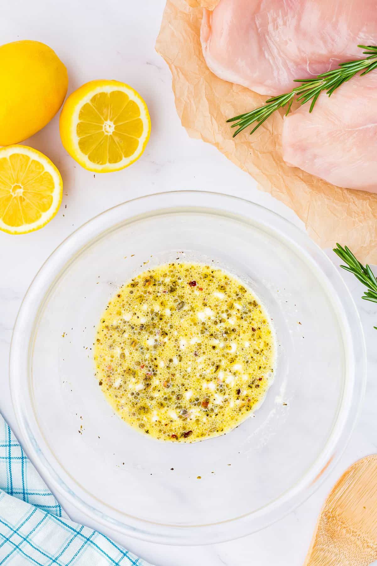 Mixed lemon marinade for chicken in bowl