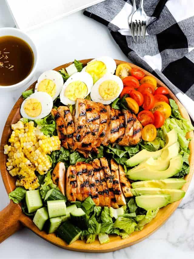 Grilled Chicken Salad Poster Image on a wooden plate