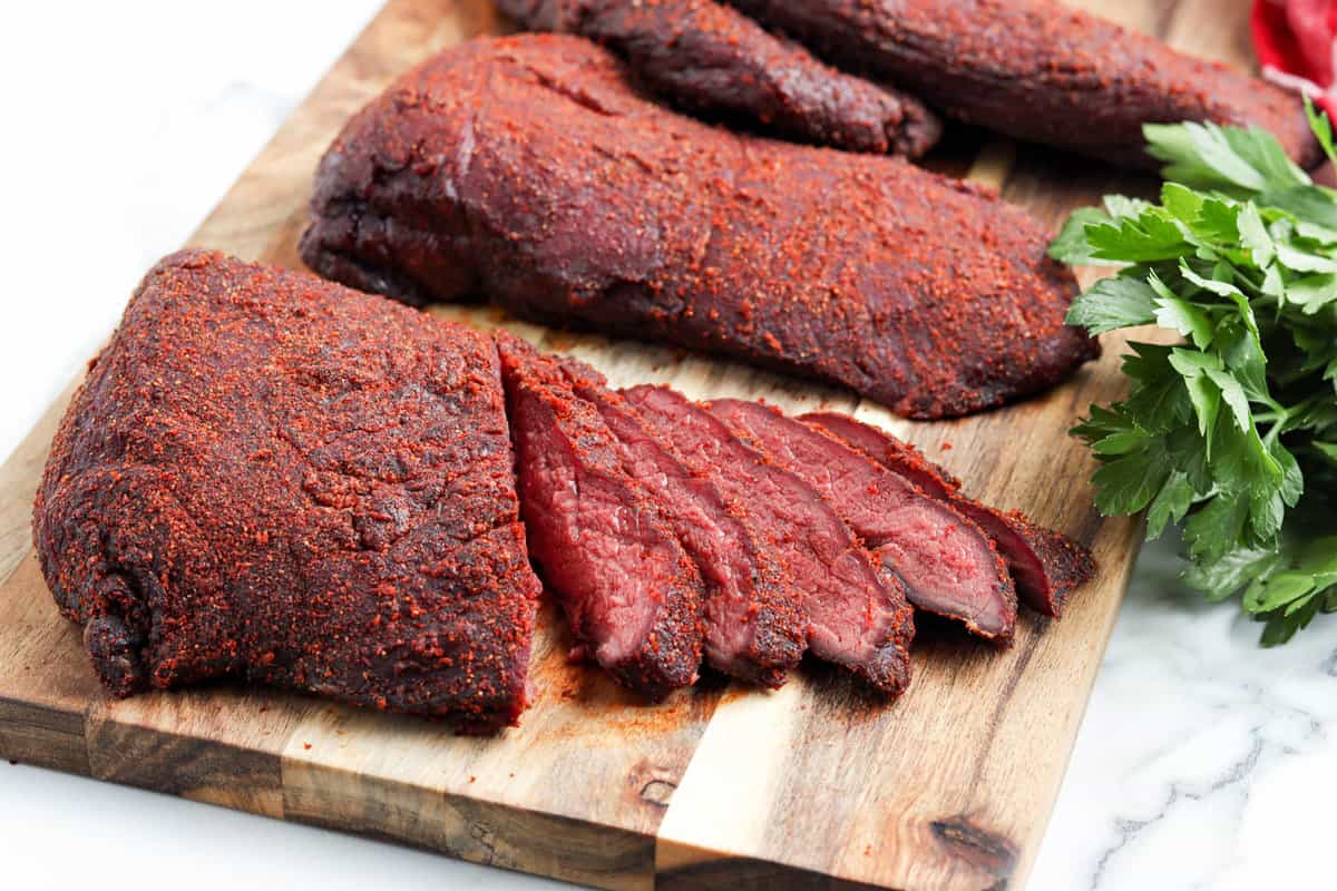 Slices of Smoked Venison Roast on Cutting Board