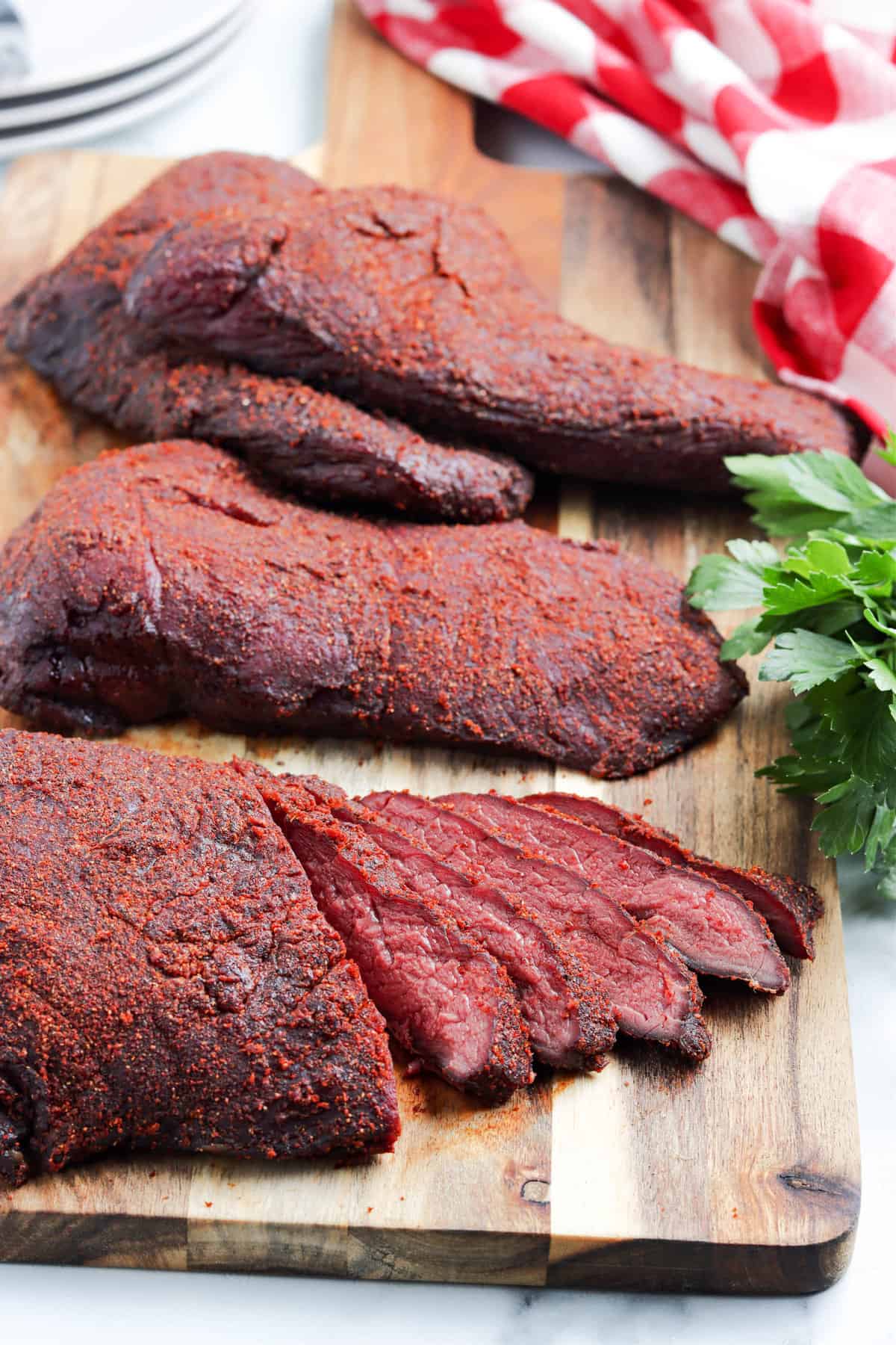 Smoked Venison Roast Recipe Sliced on Cutting Board