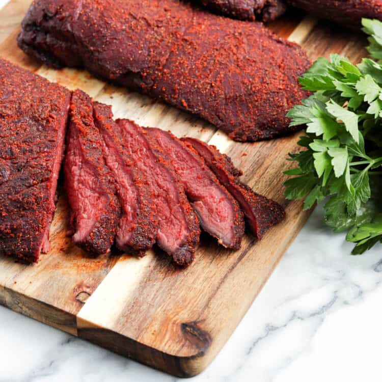 Smoked Deer Roast Recipe Sliced on Cutting Board