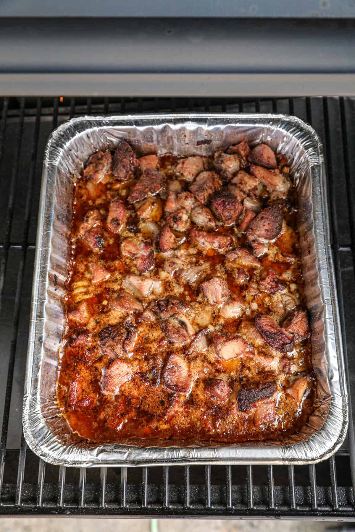 Seasoning Meat in Tin for Smoked Pork Carnitas on Pellet Grill