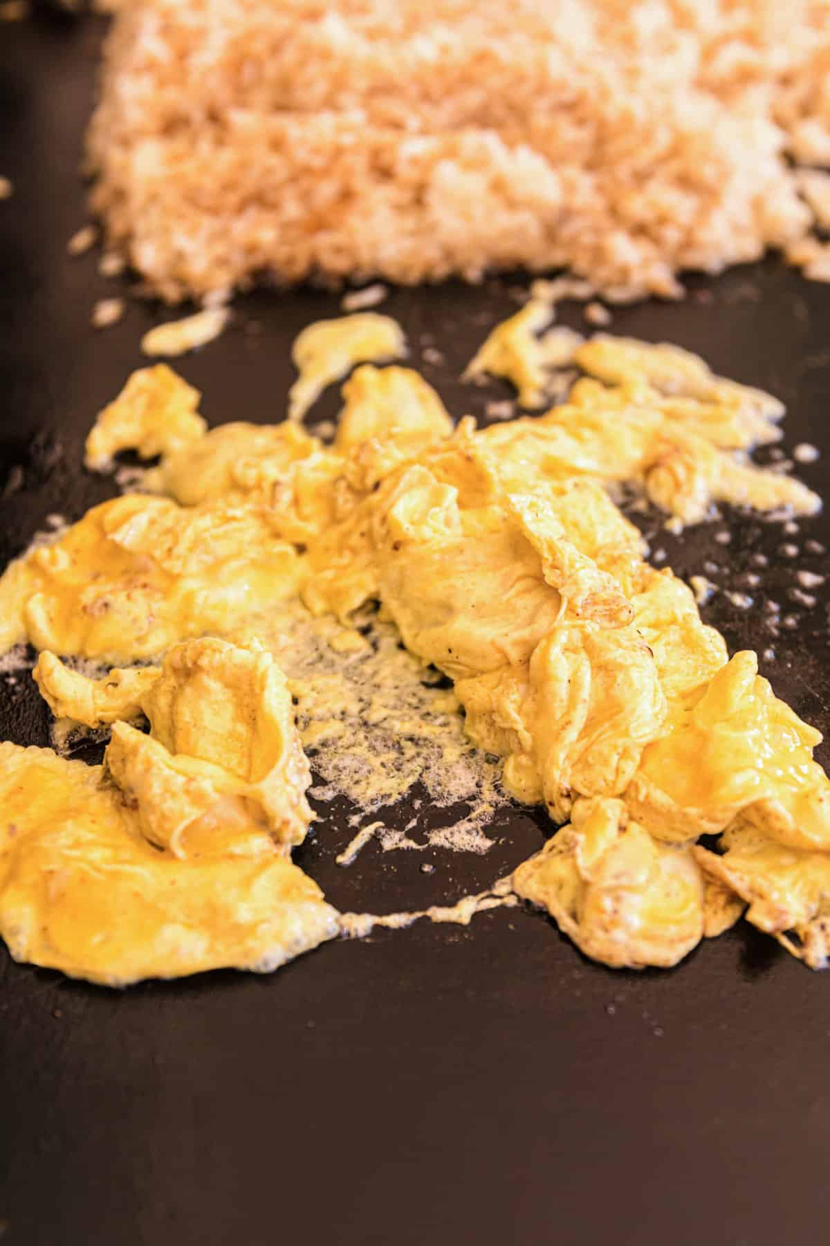 Scrambling Eggs for Blackstone Chicken Fried Rice Recipe