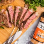 Steak on a Blackstone Sliced on Wooden Cutting Board