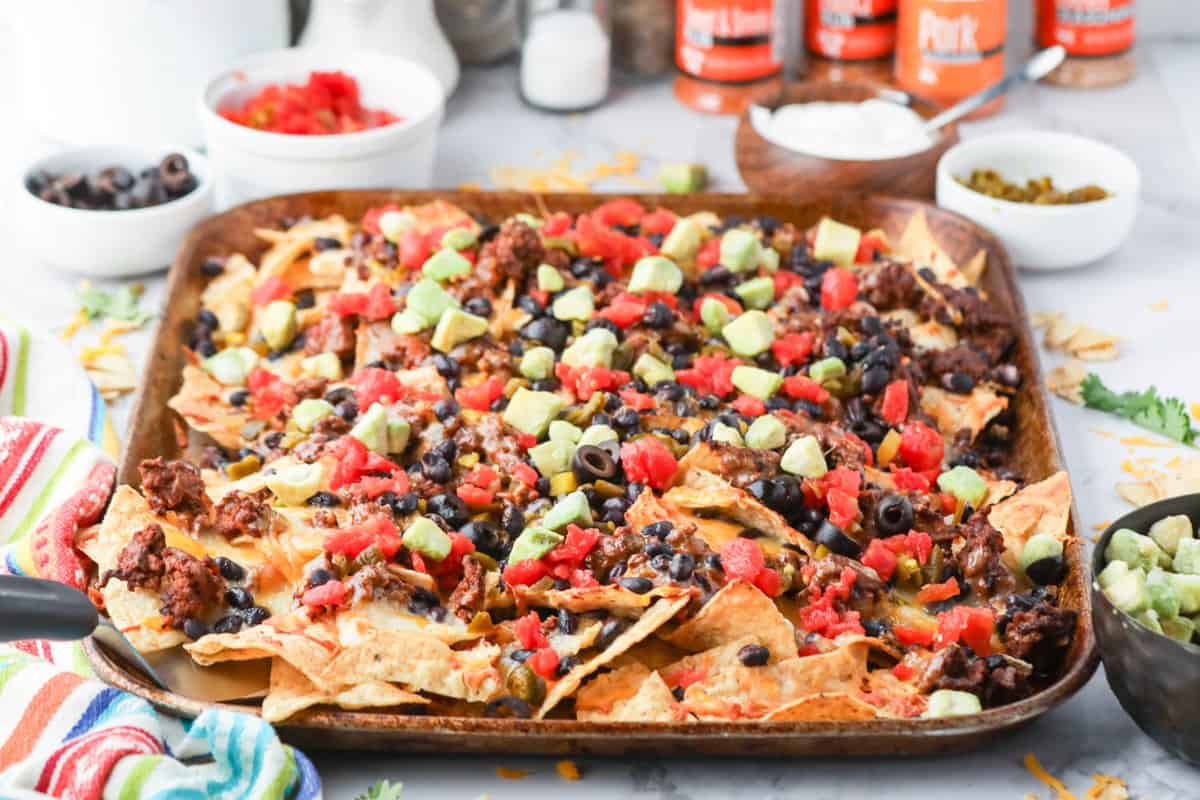 Blackstone Nachos on Baking Sheet Loaded with Toppings