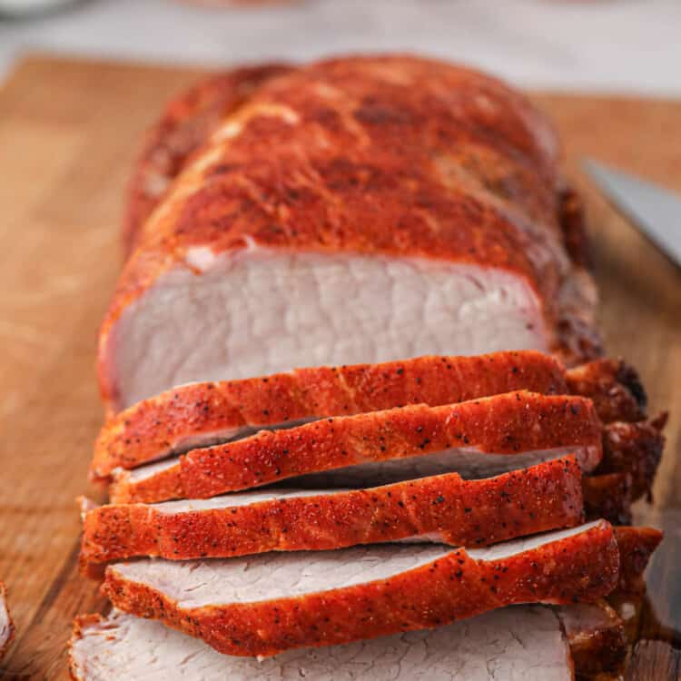 Grilled Pork Loin sliced on wooden cutting board