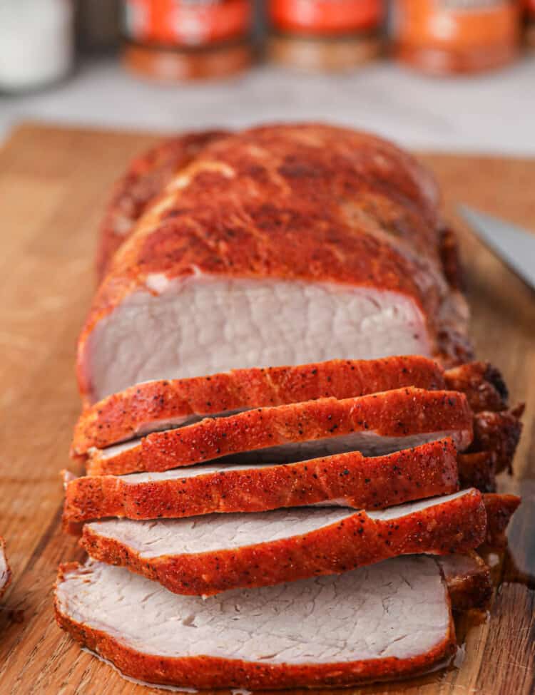 Grilled Pork Loin sliced on wooden cutting board