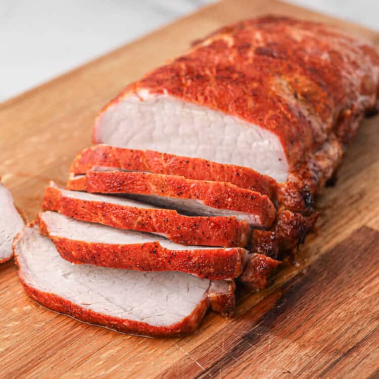 Grilled Pork Loin Sliced on Wooden Cutting Board
