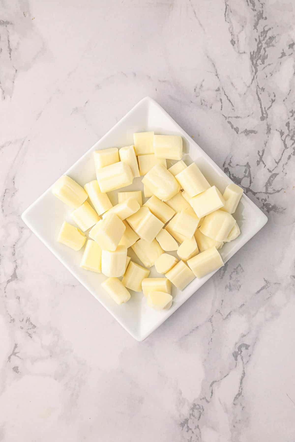 Cubed string cheese chunks for Smoked Stuffed Meatballs recipe