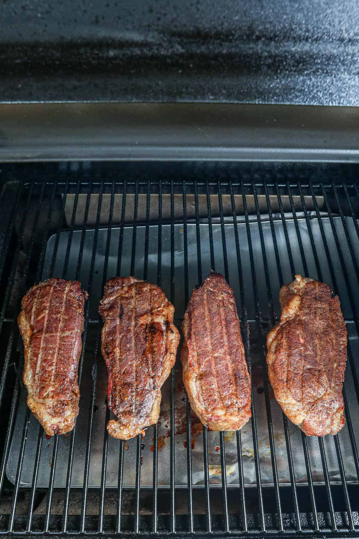 Smoked steaks on smoker grill