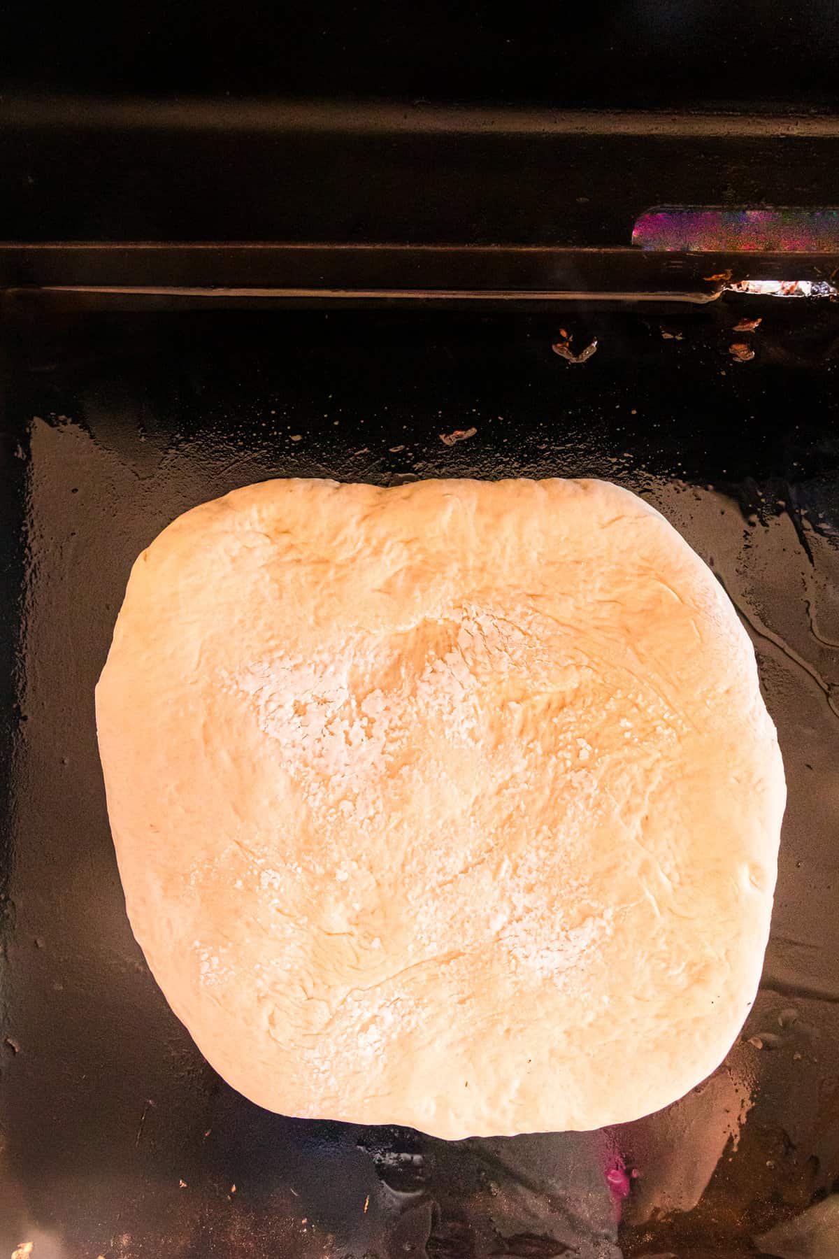 Blackstone Pizza dough on oiled Blackstone griddle