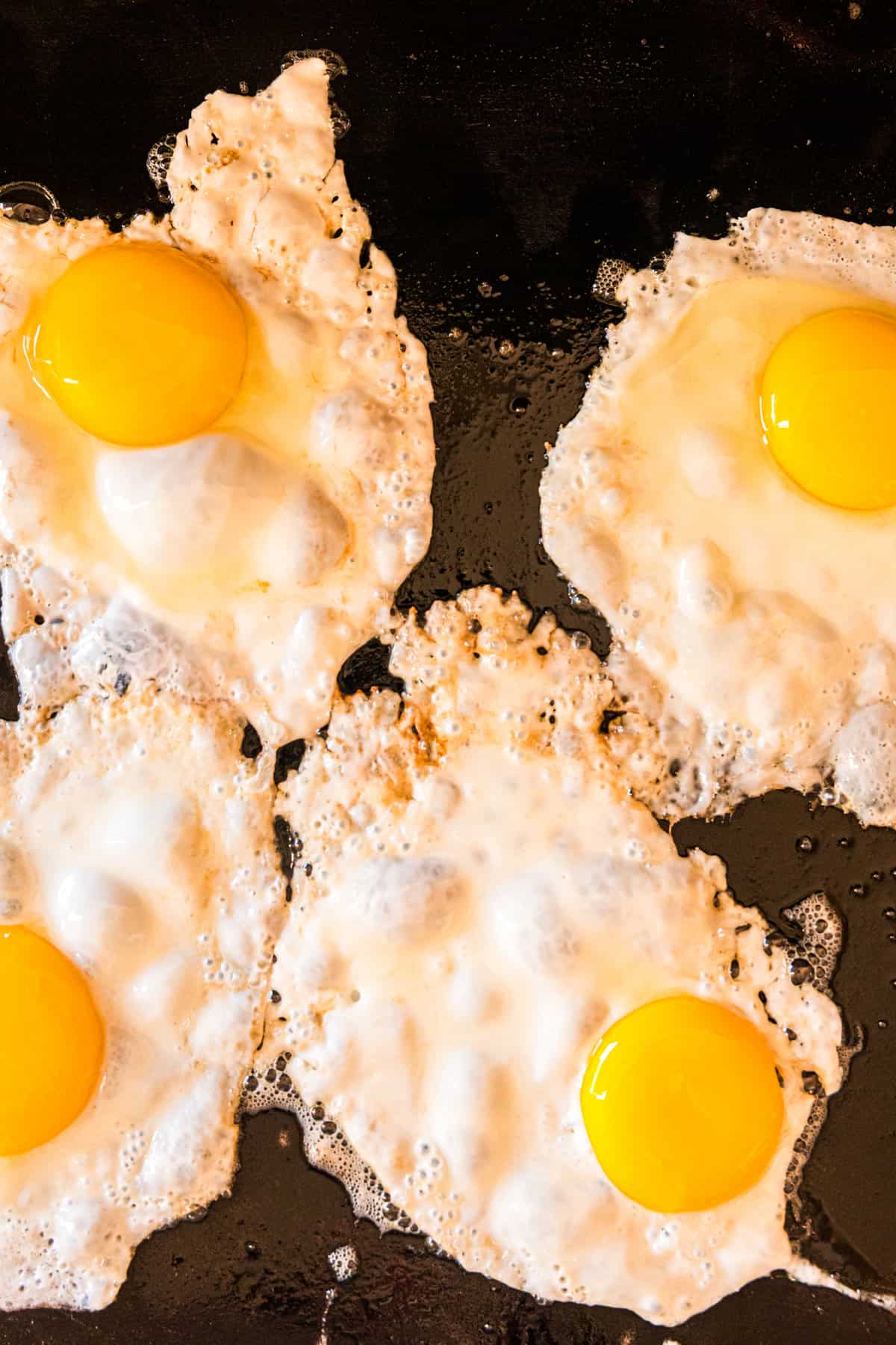 Frying eggs on Blackstone Griddle for Smash Breakfast Tacos recipe