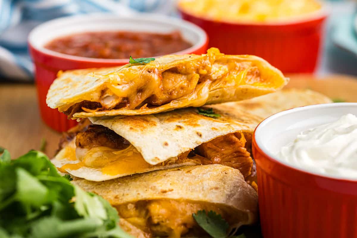 Blackstone Chicken Quesadilla cut and stacked oozing with cheese