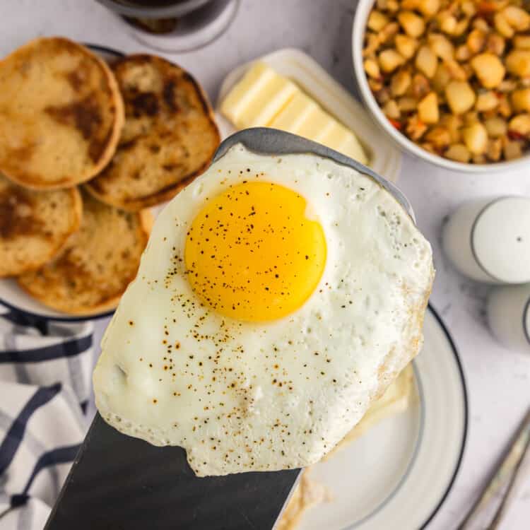 Using metal spatula for place Blackstone Fried Egg on plate
