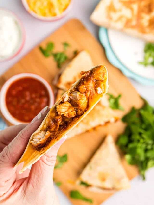 Ready to enjoy the first bite of Blackstone Chicken Quesadillas with salsa
