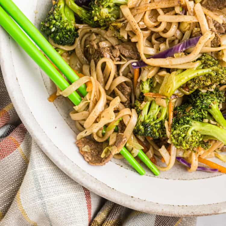 Stir fry on the Blackstone in serving bowl with chopsticks