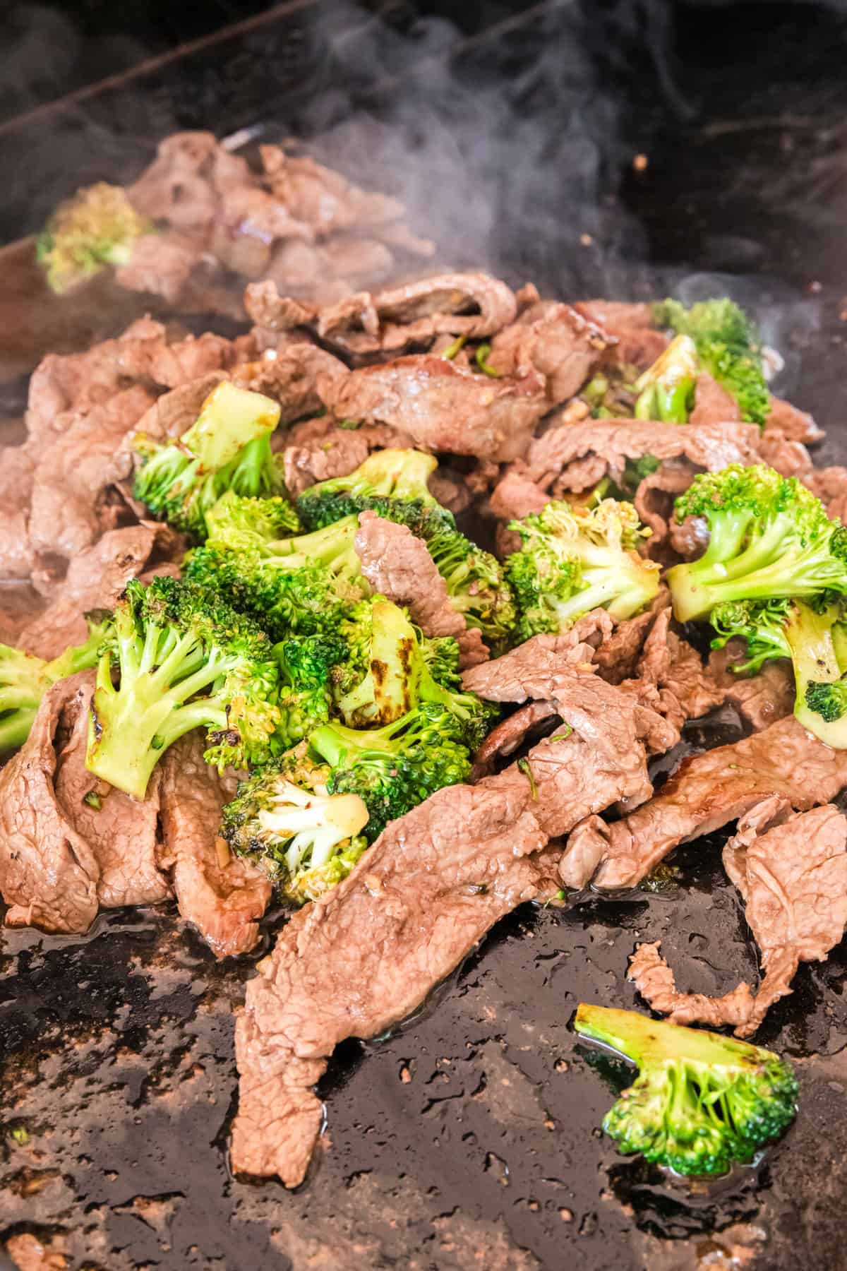 Cooked meat and broccoli for Blackstone Beef Stir Fry recipe