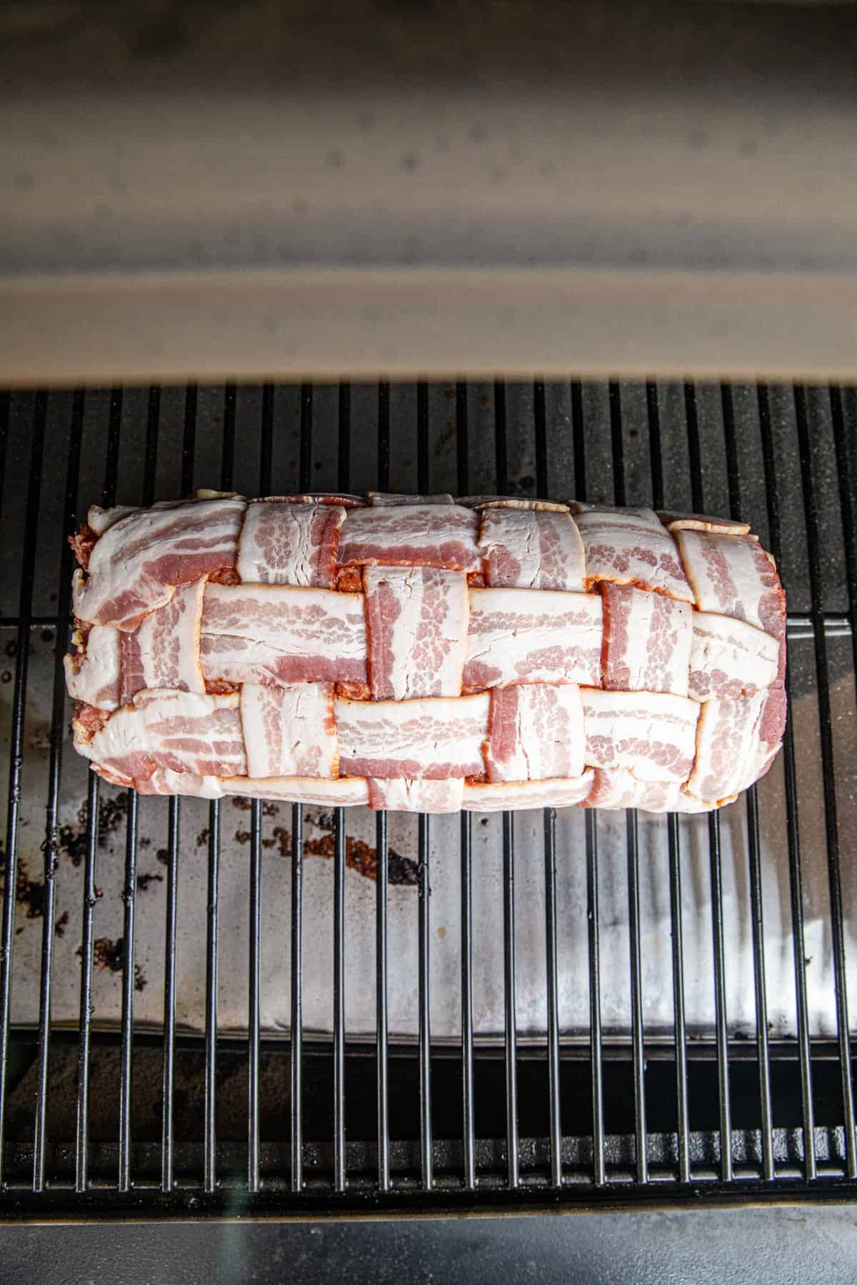 Bacon Explosion stuffed and weaved roll on grill