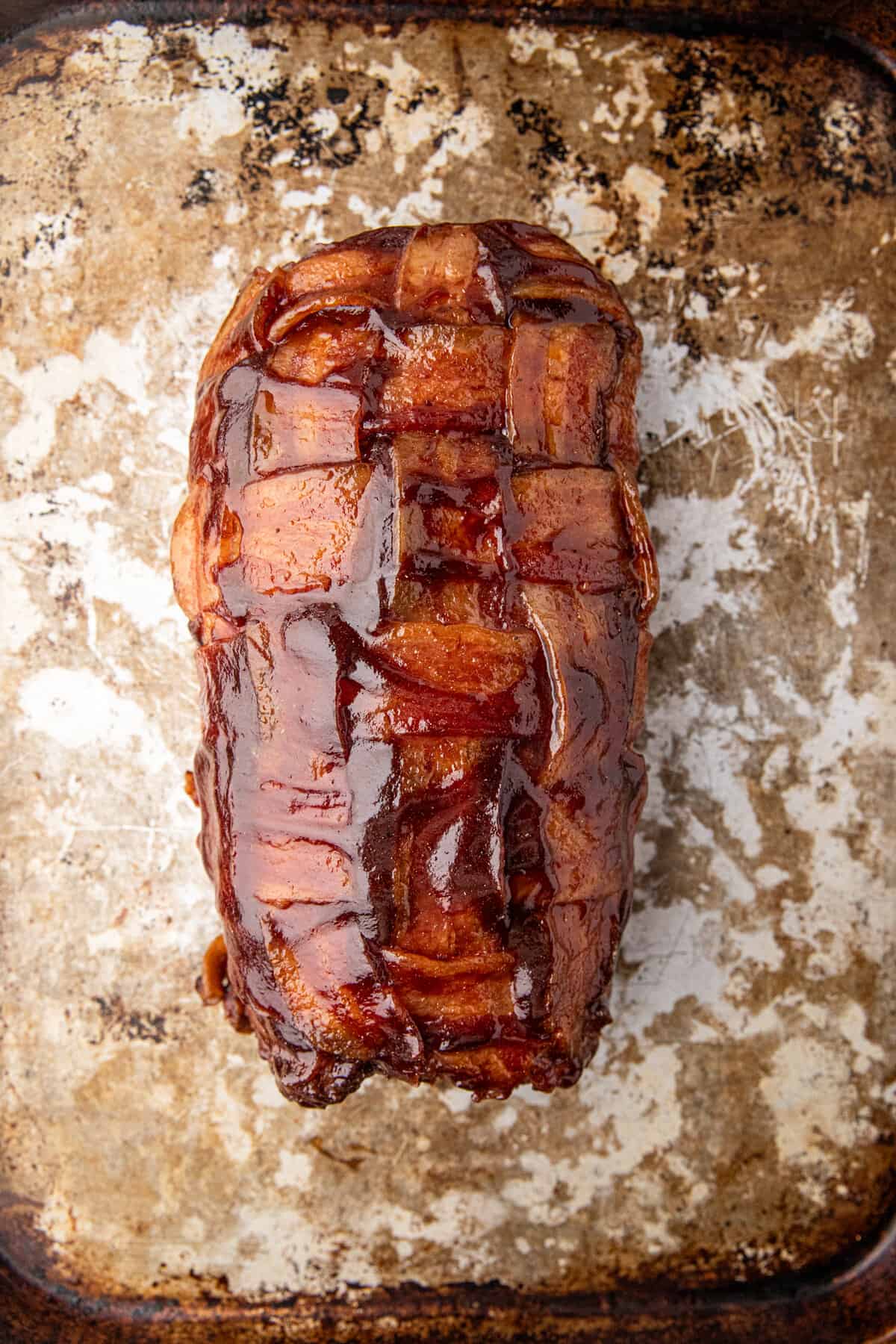 Grilled Bacon Explosion smothered in BBQ sauce