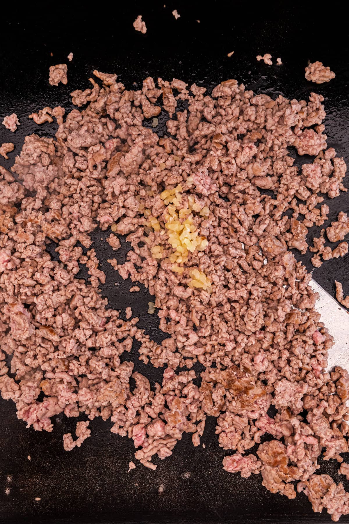 Cooking ground beef or pork on the Blackstone Griddle for   Egg Roll in a Bowl