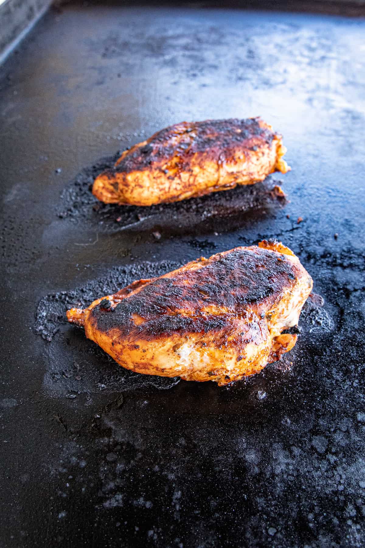 Seared marindated chicken breasts on Blackstone Griddle for Chicken Street Tacos  recipe