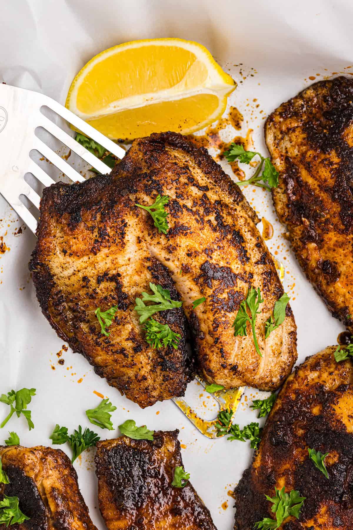 Tilapia with blackened seasoning on it