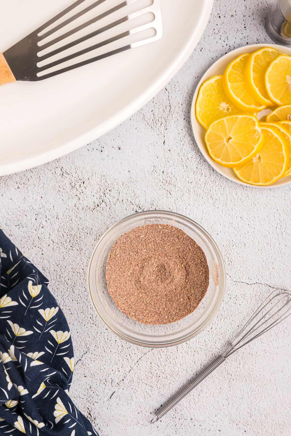 Whisking together Blackened Seasoning ingredients in small bowl with whisk