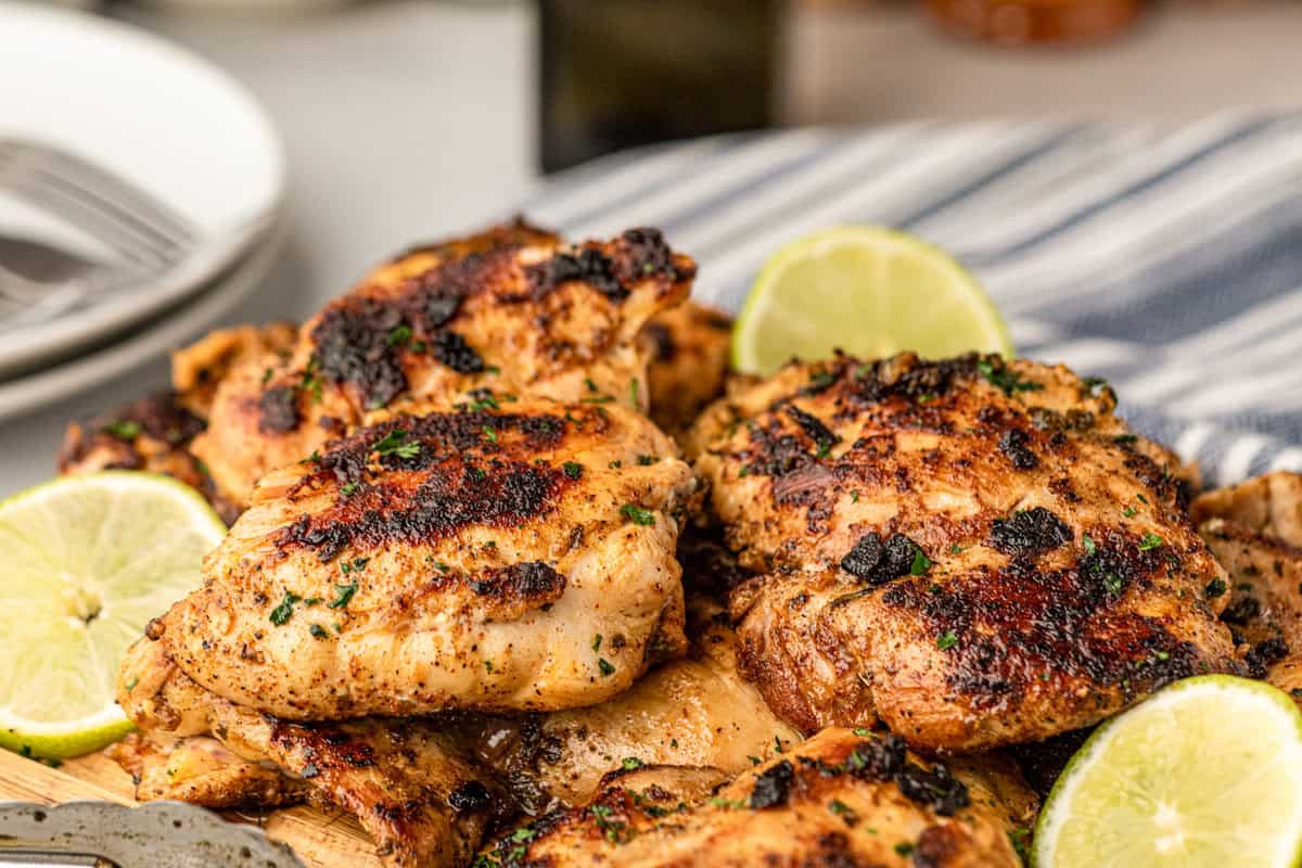 Grilled Pollo Asado arranged on serving board
