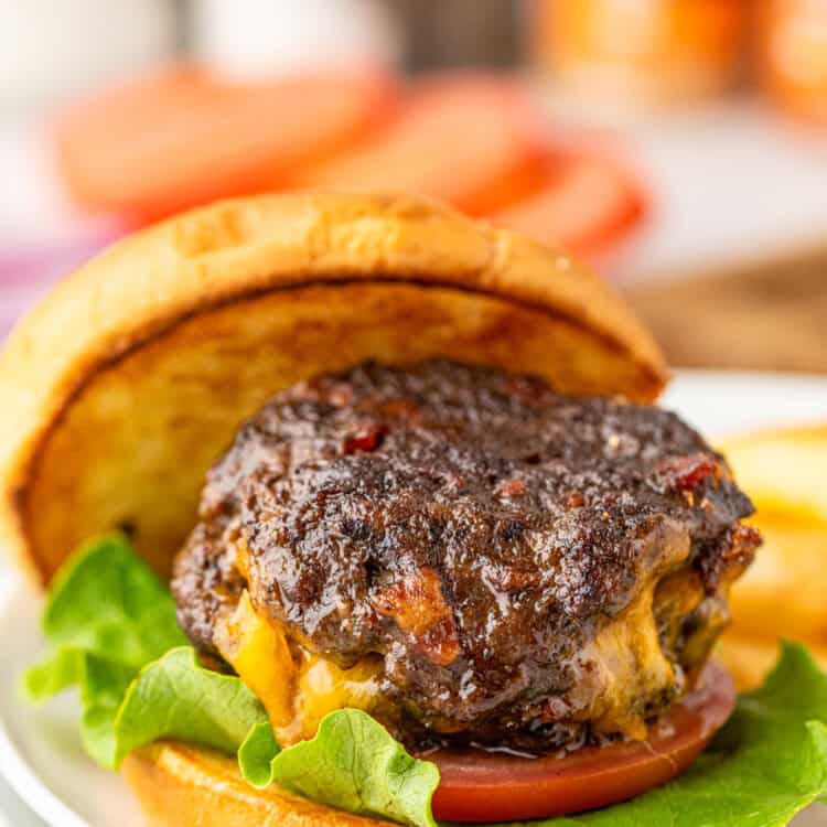 Stuffed Bacon Cheeseburger on toasted slice bun on plate